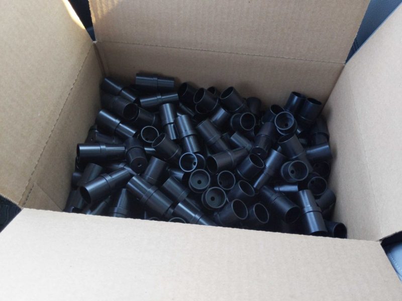 Box of black tubular plastic oxygen therapy components